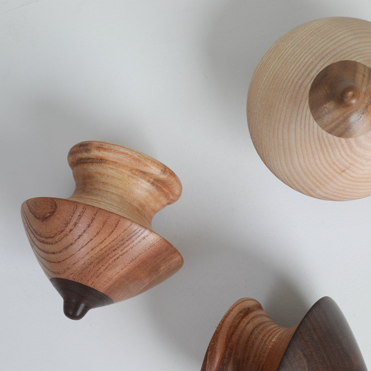 culptural wooden coat hooks handcrafted in London from reclaimed wood offcuts, featuring unique natural grain and forms.