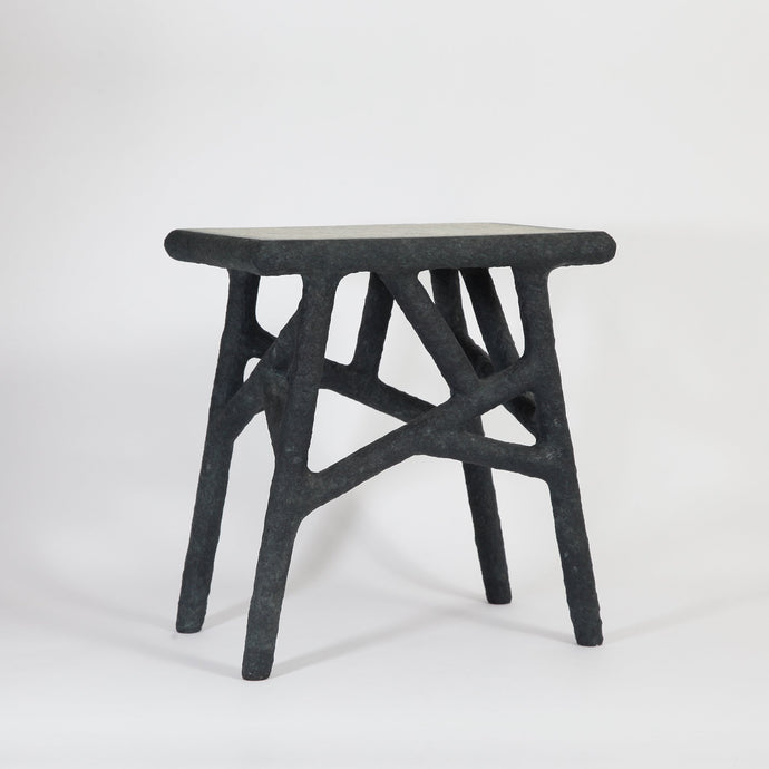 the-home-of-sustainable-things-alchemists-side-table-recycled-newspapers-studio-woojai 