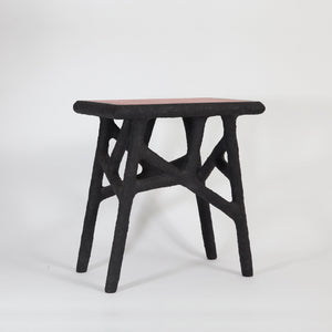 the-home-of-sustainable-things-alchemists-side-table-recycled-newspapers-studio-woojai 
