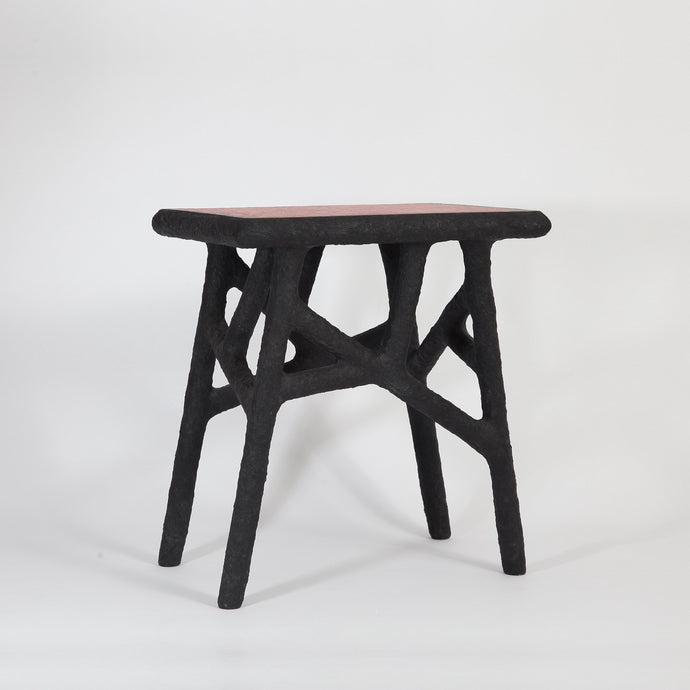 the-home-of-sustainable-things-alchemists-side-table-recycled-newspapers-studio-woojai 